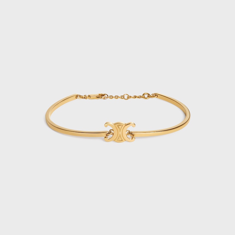triomphe articulated bracelet in brass with gold finish