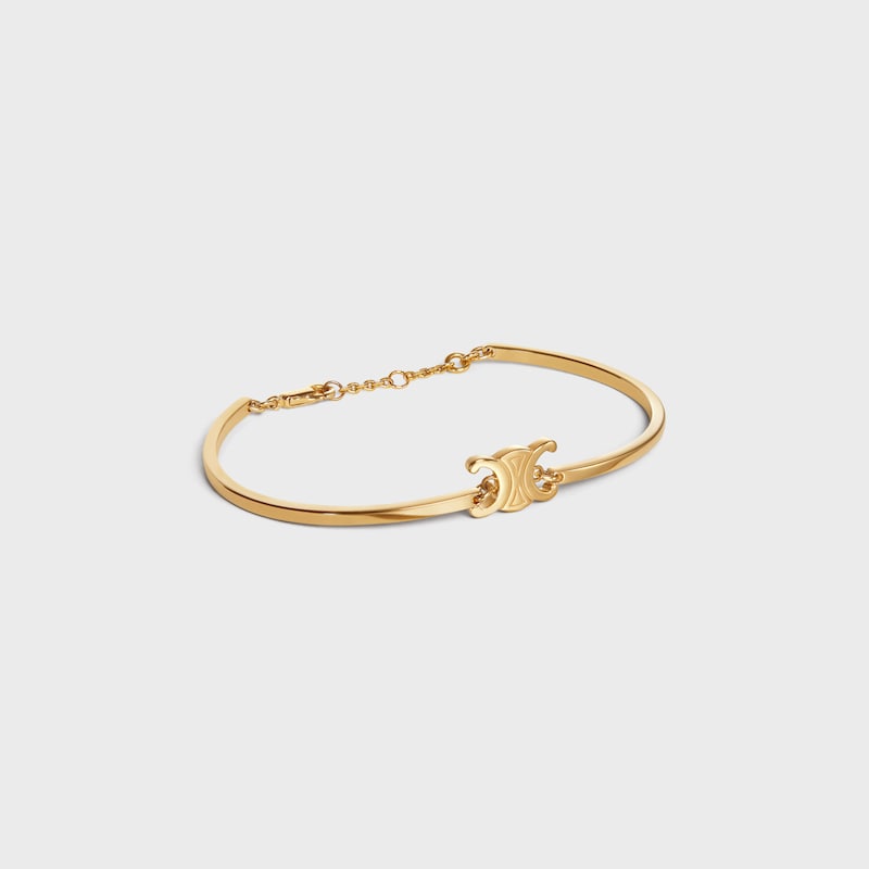 triomphe articulated bracelet in brass with gold finish