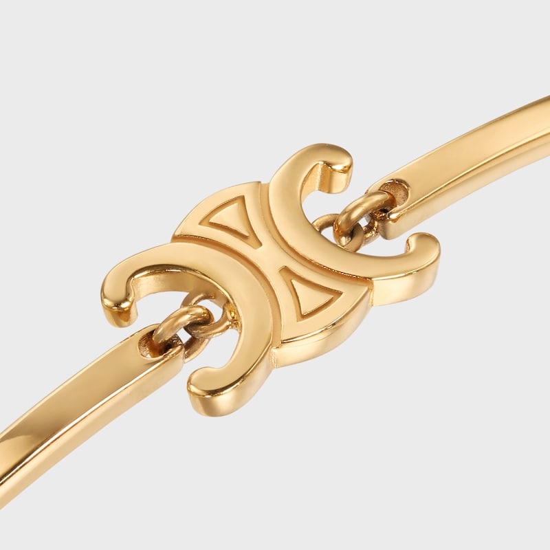 triomphe articulated bracelet in brass with gold finish