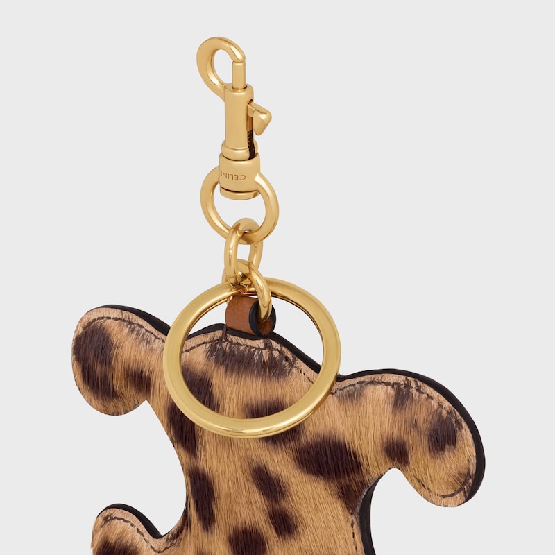 triomphe pom-pom keyring in pony with leopard print and calfskin