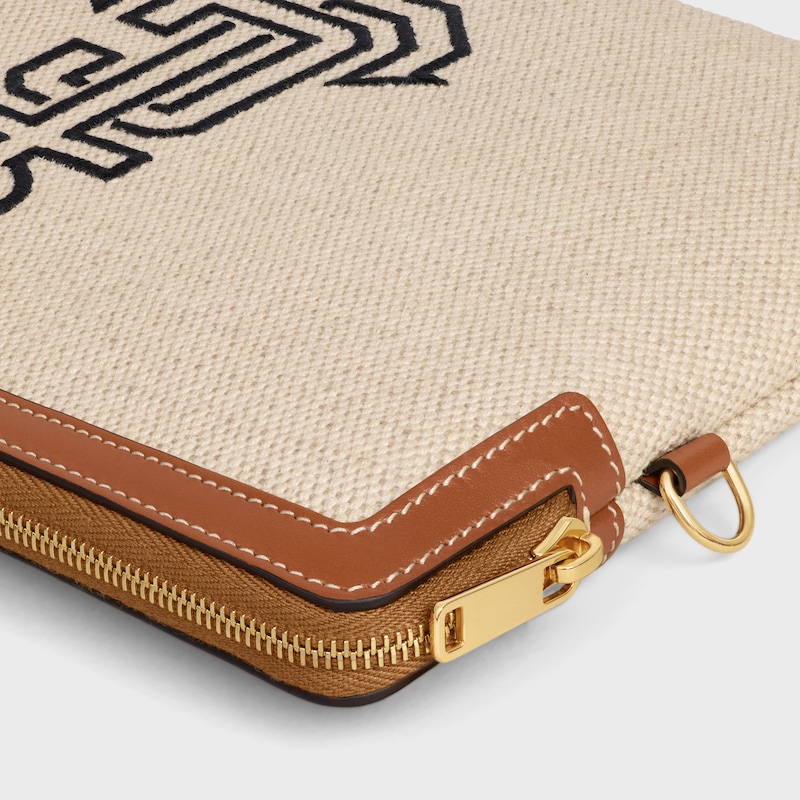 small pouch with strap in textile with anchor embroidery and calfskin
