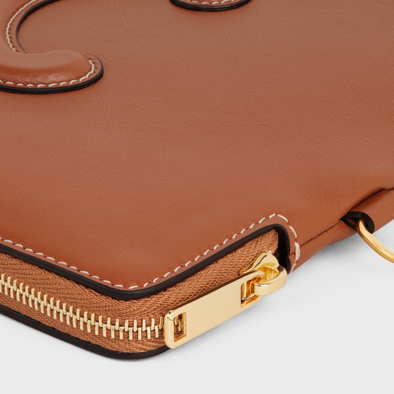 small pouch with strap cuir triomphe in smooth calfskin